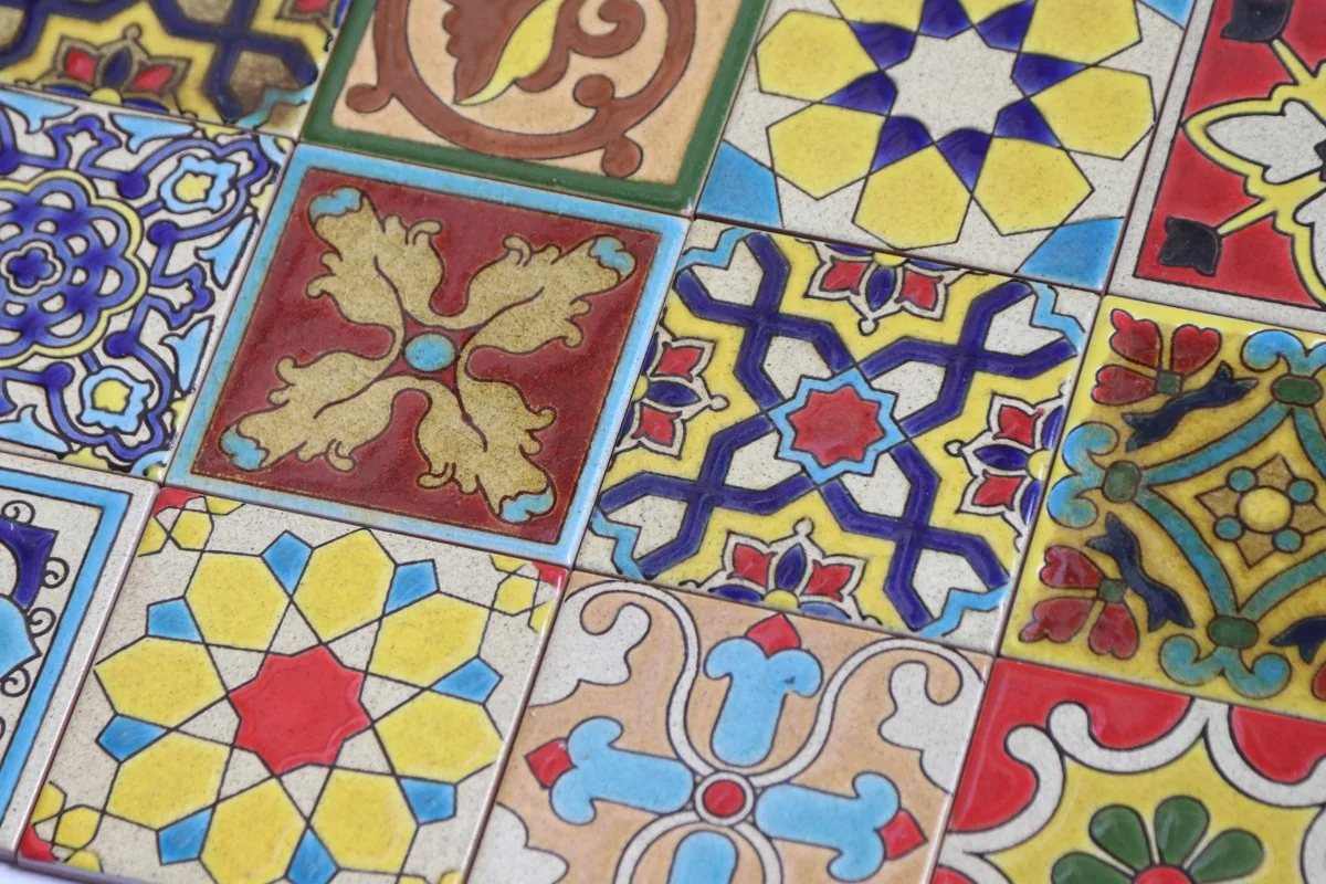 A collection of colorful handmade decorative tiles from TilesandArt